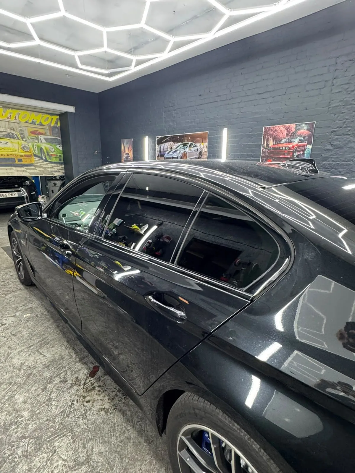 Black saloon with tinted side windows